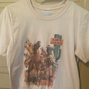 Boutique western t-shirt, knot tied at bottom.